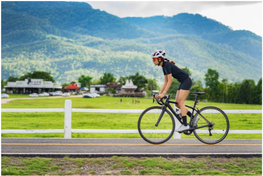 Person riding a bike outdoors.
