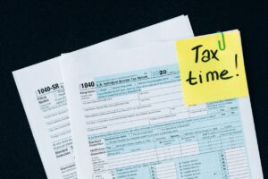 tax forms with a note that says "Tax time!"