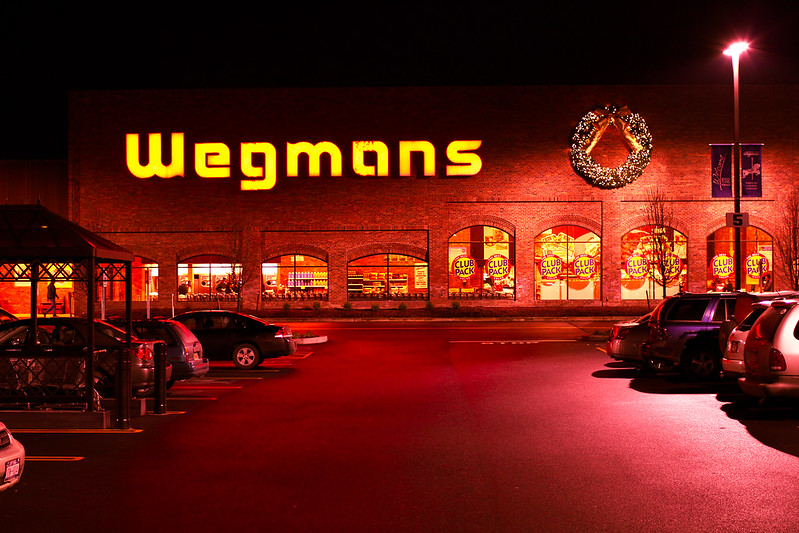Exterior of a Wegmans supermarket at night