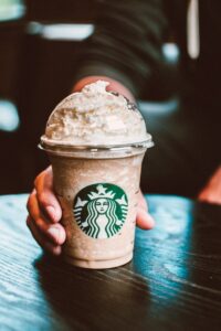 a Starbucks drink topped with whipped cream