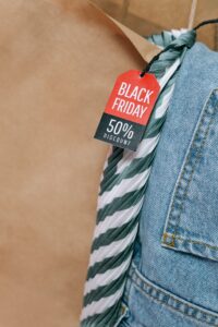 a tag on clothing that says Black Friday 50 percent discount