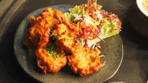 fritters and salad on a plate