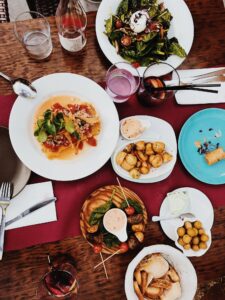 A dinner table with plates of food