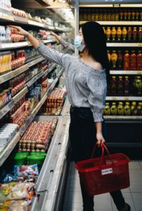 A woman grocery shopping