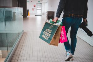 A man at a mall with shopping bags