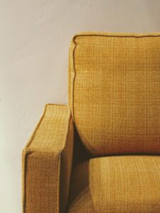 The side of a yellow couch