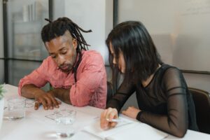 Two people looking over a blueprint