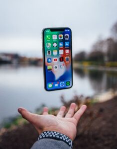 A phone hovering over a hand