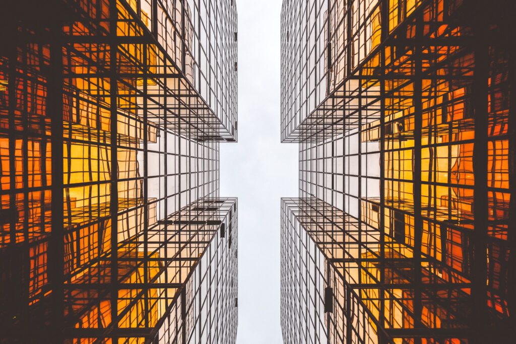 Two buildings designed with proportions to create negative space between them that is in a cross shape