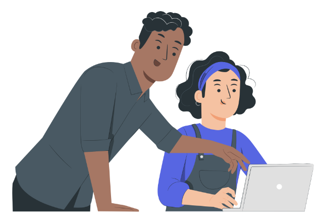 A person at their laptop with a teacher pointing to it.