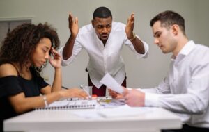 Three co-workers having a heated discussion