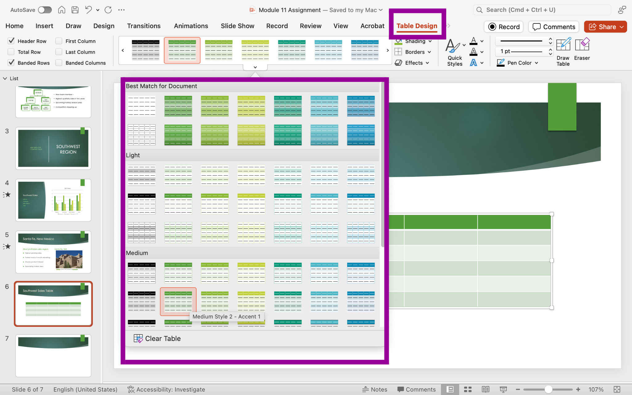 PowerPoint screenshot of open presentation with a new inserted table being drawn into the slide with style options in table design tab.