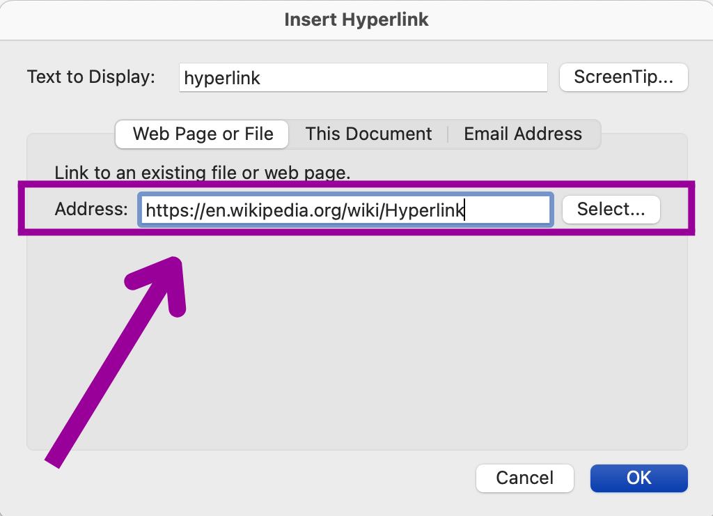 A hyperlink dialog box is open on display. There is a magenta green arrow pointing at a magenta box which is highlighting where the "Address" is going to on the hyperlink.